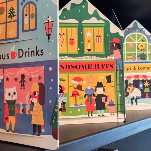 No livro de Natal "Christmas Street", em acordeão e com "janelas/abas" para abrir, descobrimos o que acontece em cada casa desta rua ilustrada.